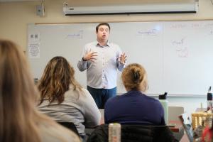 Matt Thome '17, who earned a communication degree, visiting a Crisis Communication class.